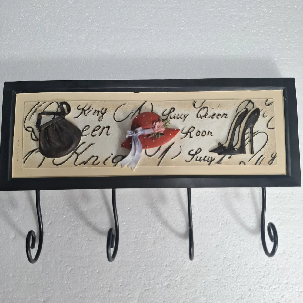 Wall Hook Rack with Black Frame and Red Hat Accent